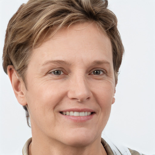 Joyful white adult female with short  brown hair and grey eyes