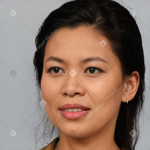 Joyful asian adult female with medium  brown hair and brown eyes