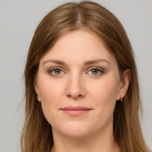 Joyful white young-adult female with long  brown hair and grey eyes