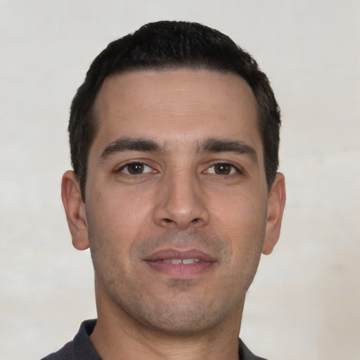 Neutral white young-adult male with short  black hair and brown eyes