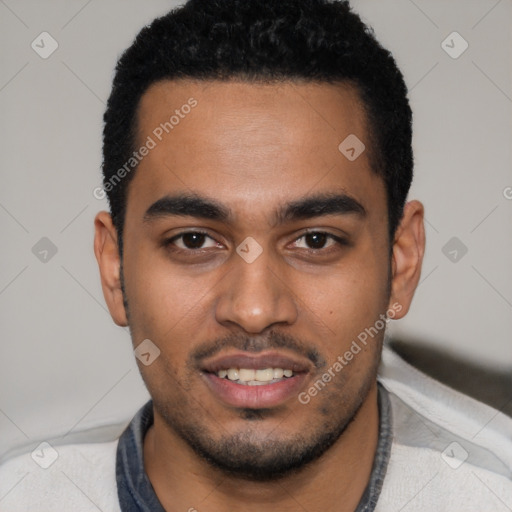 Joyful black young-adult male with short  black hair and brown eyes