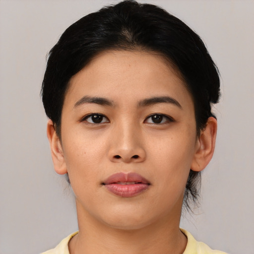 Joyful asian young-adult female with short  black hair and brown eyes