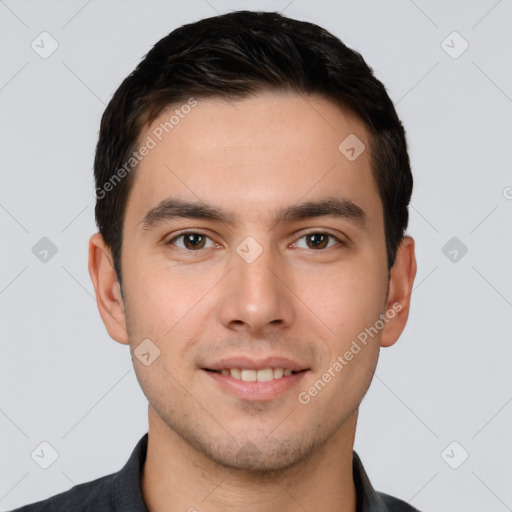 Joyful white young-adult male with short  black hair and brown eyes