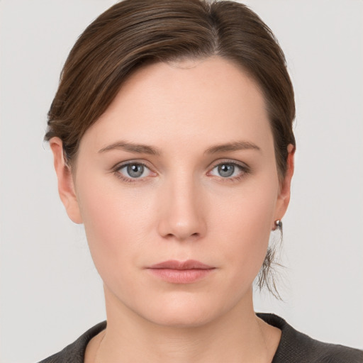 Neutral white young-adult female with short  brown hair and grey eyes