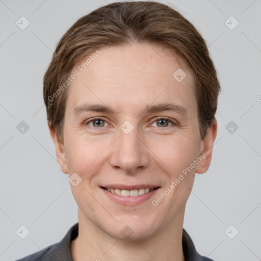 Joyful white young-adult female with short  brown hair and grey eyes