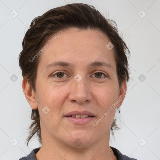 Joyful white adult female with medium  brown hair and brown eyes