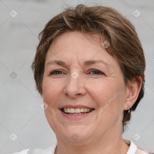 Joyful white middle-aged female with medium  brown hair and brown eyes