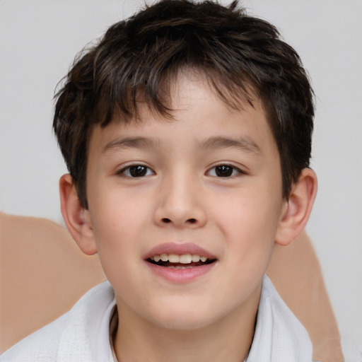 Joyful white child male with short  brown hair and brown eyes