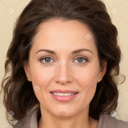 Joyful white adult female with long  brown hair and brown eyes