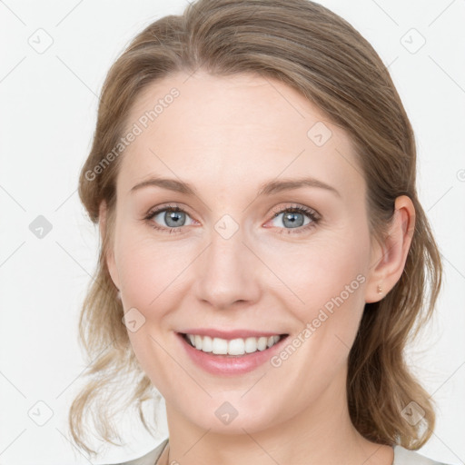 Joyful white young-adult female with medium  brown hair and blue eyes