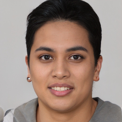 Joyful asian young-adult female with short  black hair and brown eyes