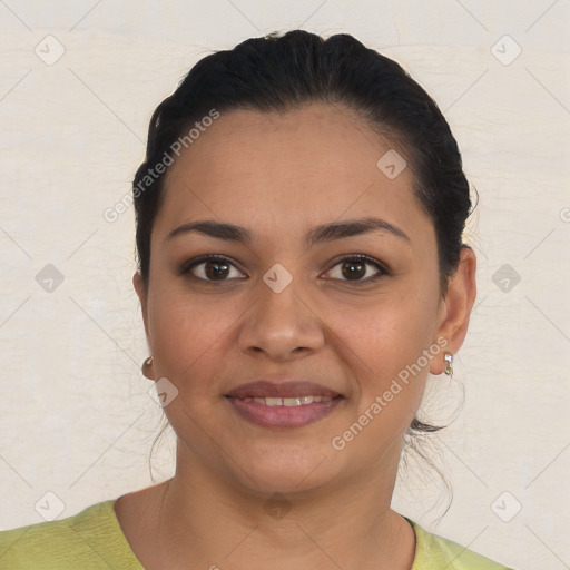 Joyful latino young-adult female with short  brown hair and brown eyes