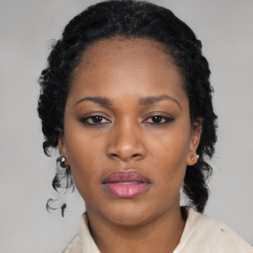 Neutral black young-adult female with medium  black hair and brown eyes