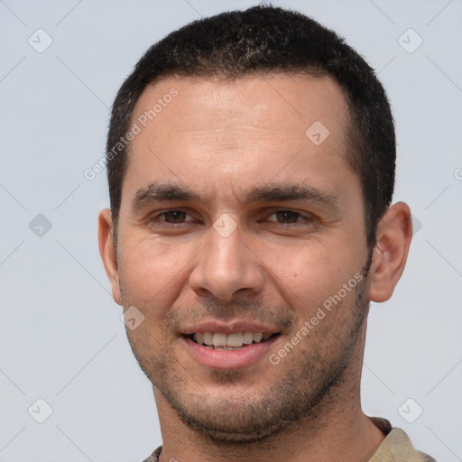 Joyful white young-adult male with short  black hair and brown eyes