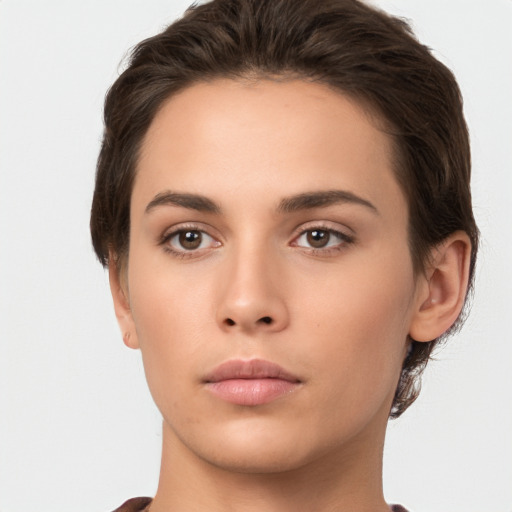 Neutral white young-adult female with short  brown hair and brown eyes