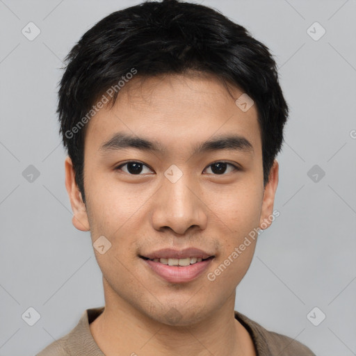 Joyful asian young-adult male with short  black hair and brown eyes