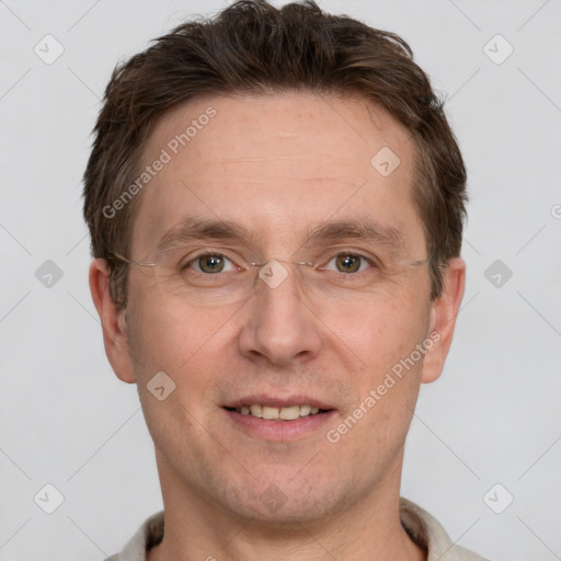 Joyful white adult male with short  brown hair and grey eyes