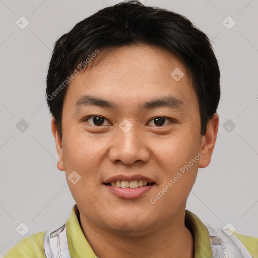 Joyful white young-adult male with short  black hair and brown eyes