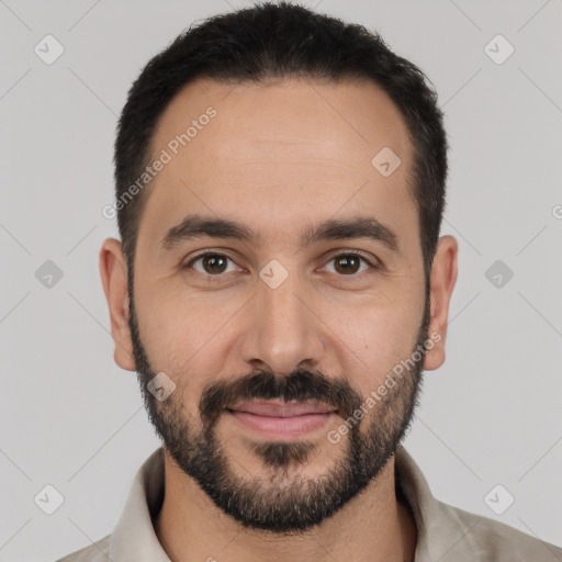 Joyful white young-adult male with short  black hair and brown eyes