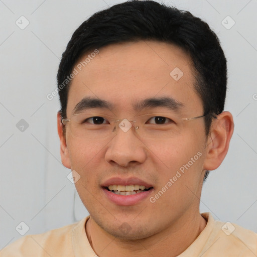 Joyful asian young-adult male with short  black hair and brown eyes