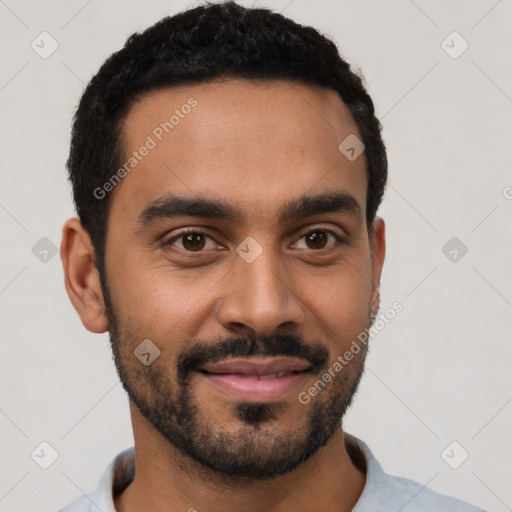 Joyful black young-adult male with short  black hair and brown eyes