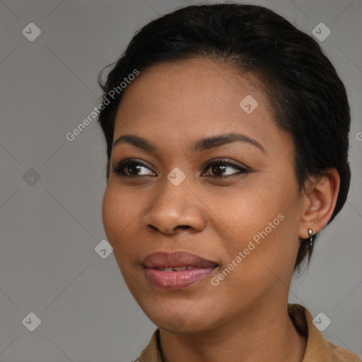 Joyful black young-adult female with medium  brown hair and brown eyes