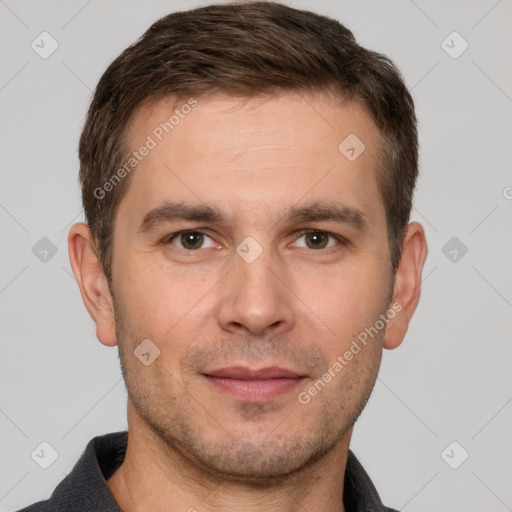 Joyful white adult male with short  brown hair and brown eyes