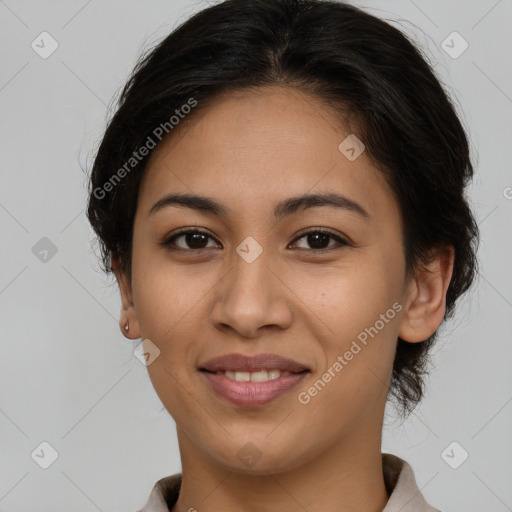 Joyful latino young-adult female with short  brown hair and brown eyes