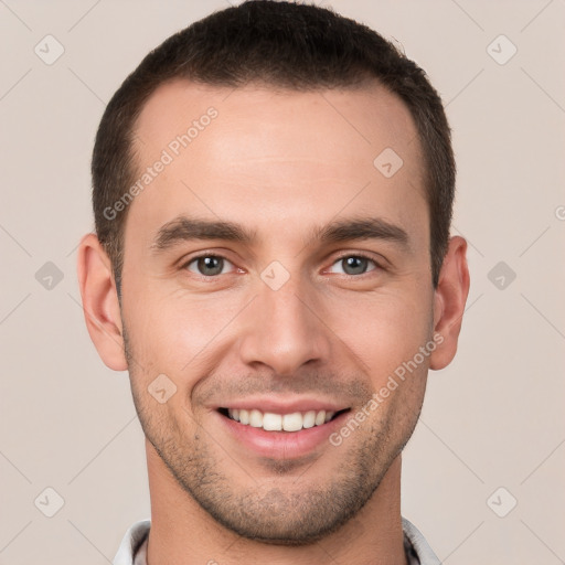 Joyful white young-adult male with short  brown hair and brown eyes