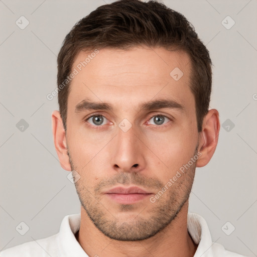 Neutral white young-adult male with short  brown hair and grey eyes