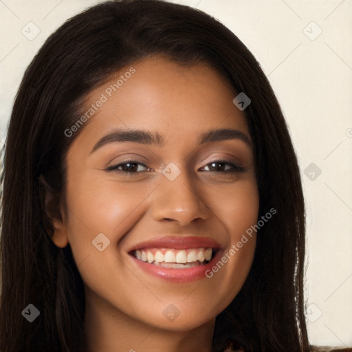 Joyful latino young-adult female with long  brown hair and brown eyes