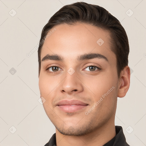 Joyful white young-adult male with short  brown hair and brown eyes