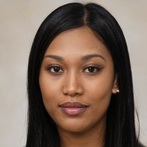 Joyful asian young-adult female with long  black hair and brown eyes