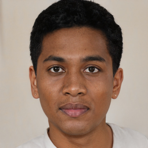Neutral black young-adult male with short  black hair and brown eyes