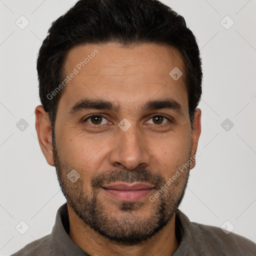 Joyful white adult male with short  black hair and brown eyes