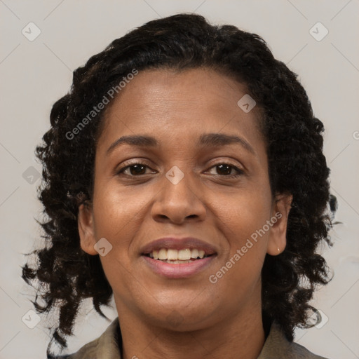 Joyful black young-adult female with medium  brown hair and brown eyes