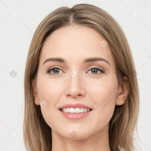 Joyful white young-adult female with long  brown hair and green eyes