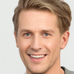 Joyful white adult male with short  brown hair and grey eyes