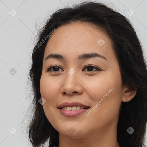 Joyful asian young-adult female with long  brown hair and brown eyes