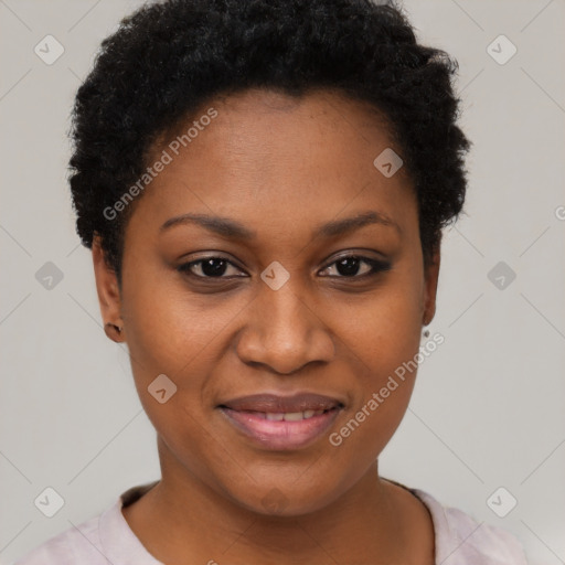 Joyful black young-adult female with short  black hair and brown eyes