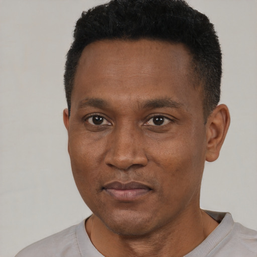 Neutral black adult male with short  black hair and brown eyes