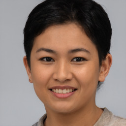 Joyful asian young-adult female with short  brown hair and brown eyes