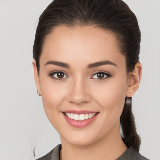 Joyful white young-adult female with medium  brown hair and brown eyes