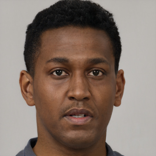 Neutral black young-adult male with short  brown hair and brown eyes