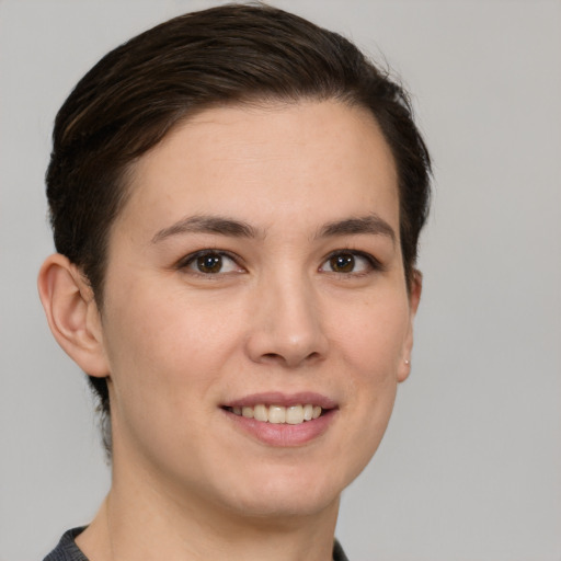 Joyful white young-adult female with short  brown hair and brown eyes