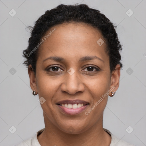 Joyful latino adult female with short  brown hair and brown eyes