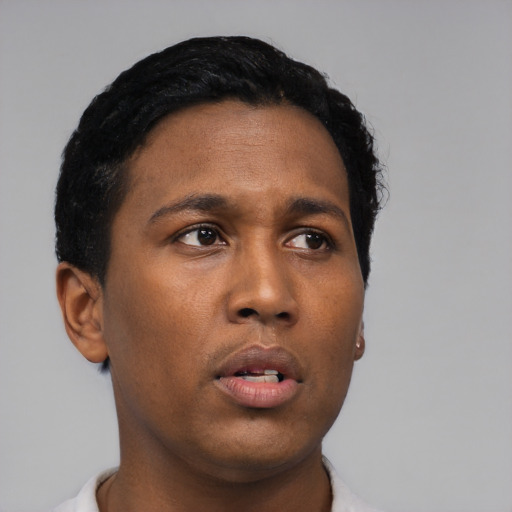Neutral black young-adult male with short  black hair and brown eyes