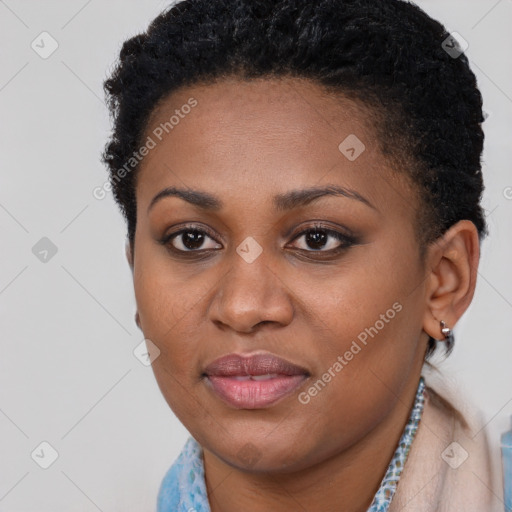 Joyful black young-adult female with short  brown hair and brown eyes