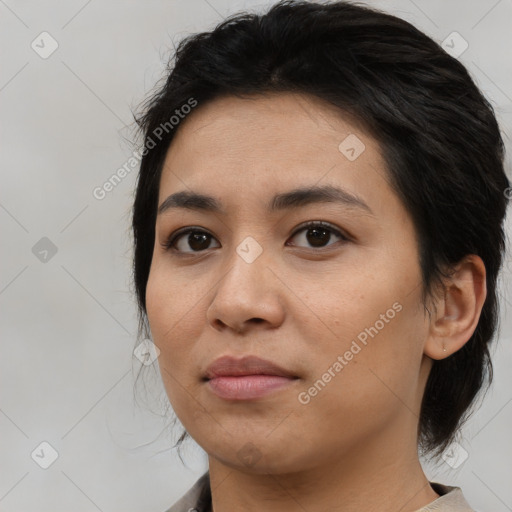 Joyful asian young-adult female with medium  black hair and brown eyes