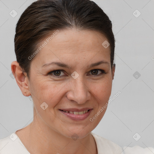 Joyful white adult female with short  brown hair and brown eyes